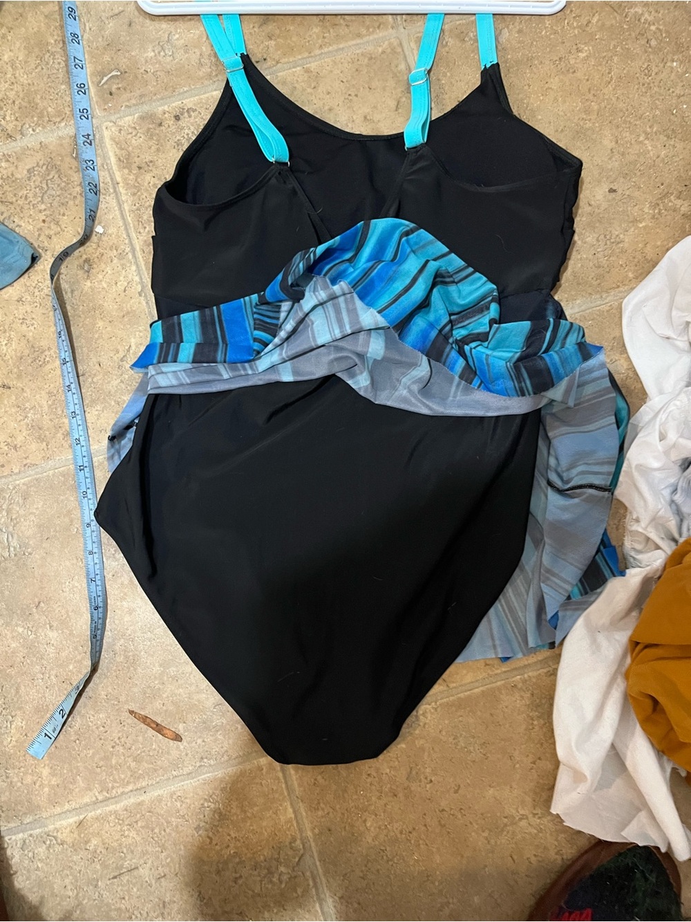 Beautiful turquoise and black bathing suit with flowy built on skirt very pretty